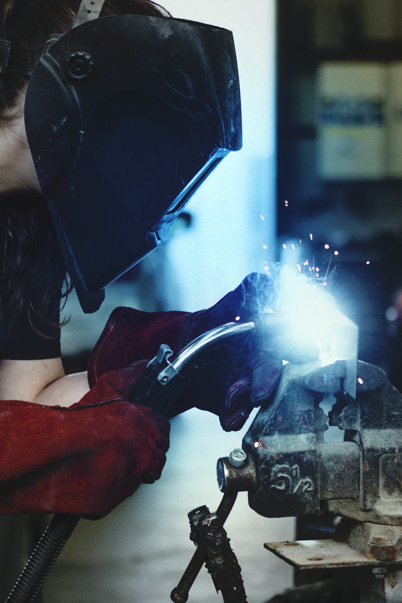Woman welding metal